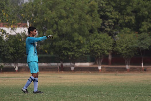 youth soccer player practicing skills on the field