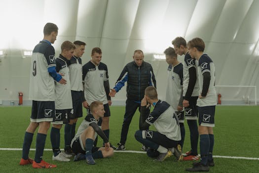 youth soccer coaches giving advice to players