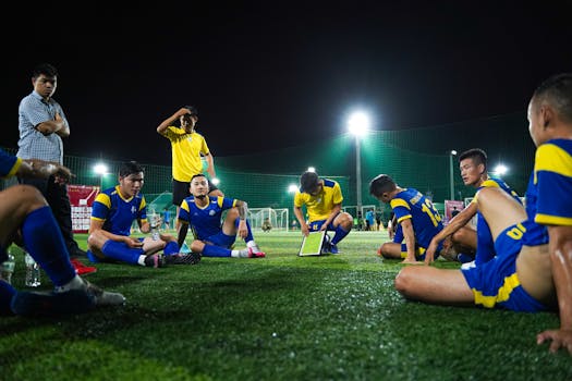 soccer coach discussing strategies with players