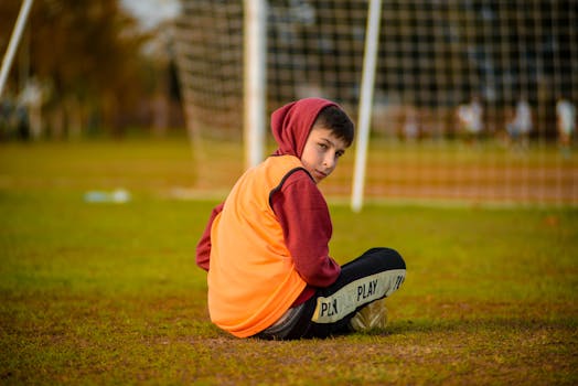 soccer player training with music playing